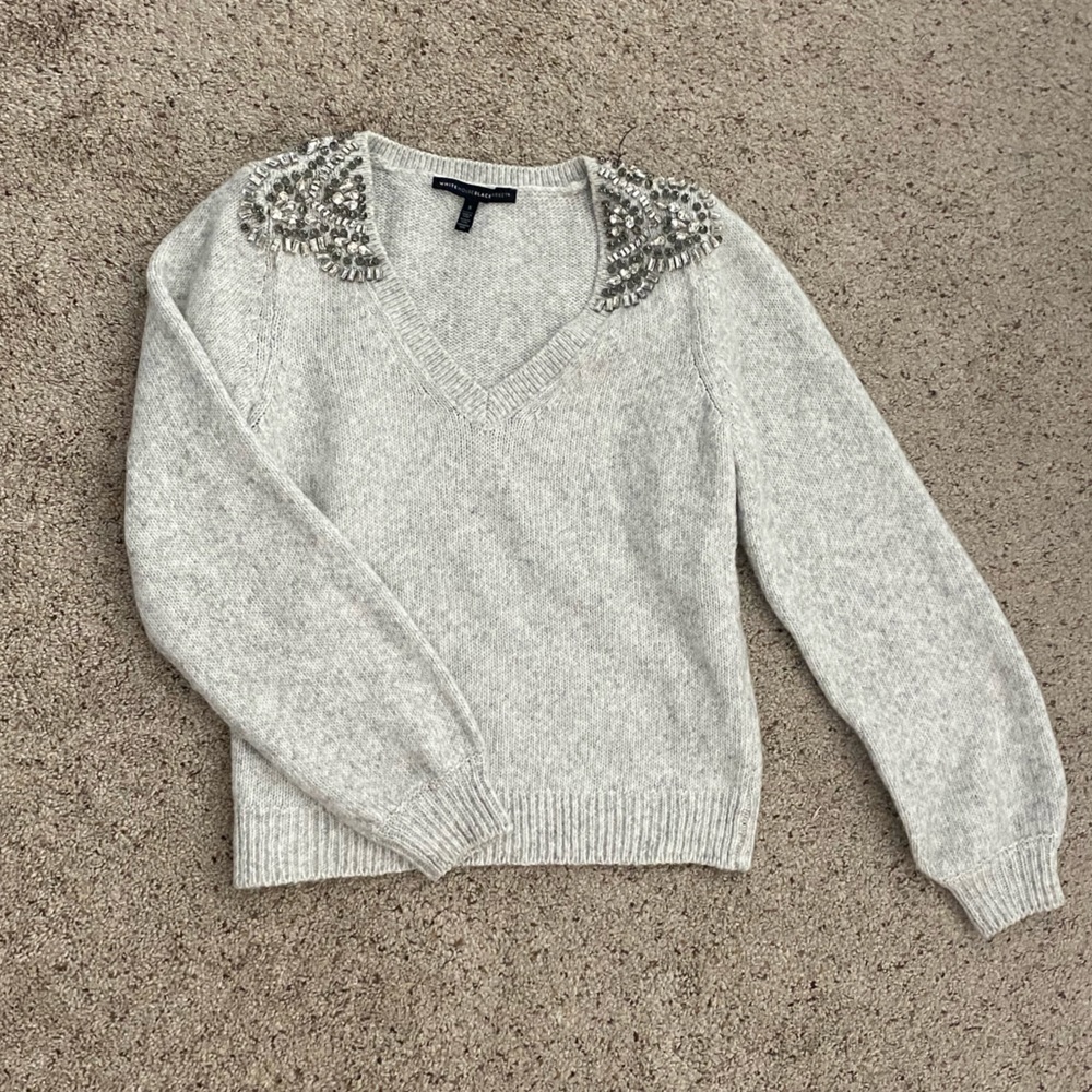 White House, Black market gray V-neck sweater with jewels on the shoulder.